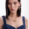 Mottled Gold Bow Pendant Necklace