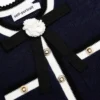 Navy Peplum Pointelle Knit Top